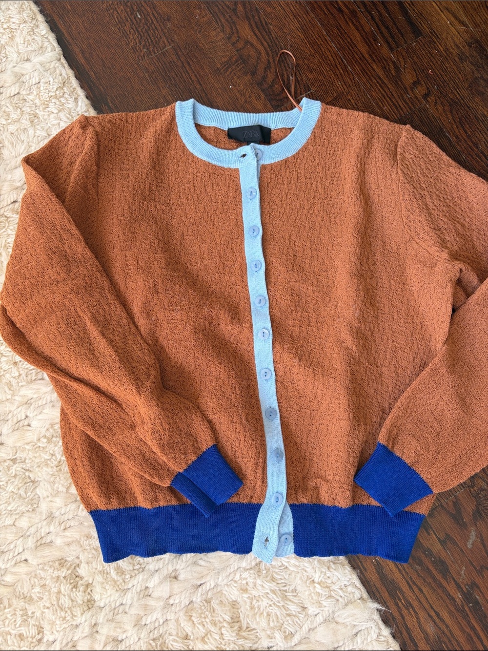 Zara Rust Cardigan with Light Blue Trim and Royal Blue Hem